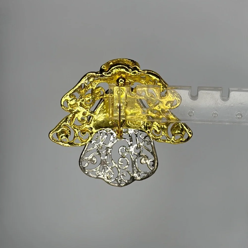 Elegant Gold and Silver Angel Brooch with Intricate Filigree
